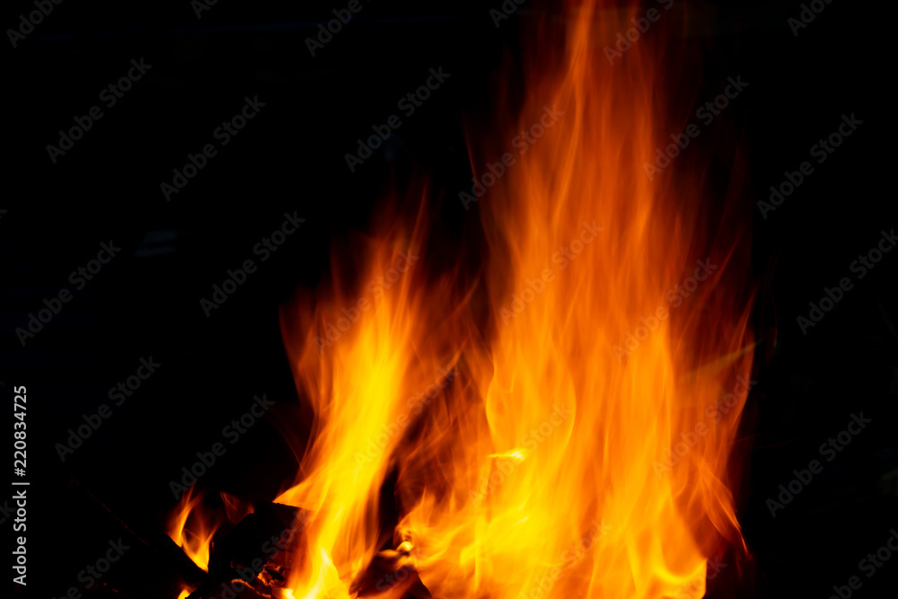 Flames of fire from burning coals in the grill late at night. Flames of fire from burning coals in the grill late at night.