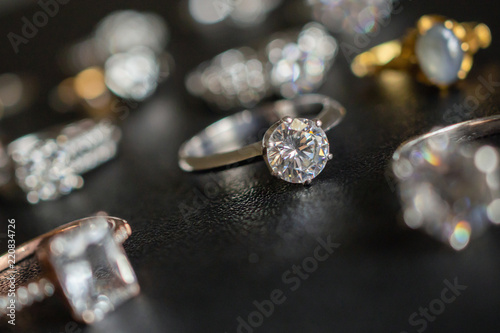 Jewelry diamond rings on black background close up