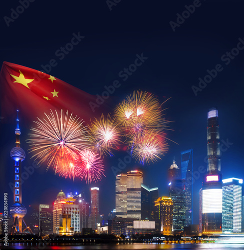 china nation day celebrate night in Shanghai city with celebration fireworks and light from modern city skyscrapers and reflection of beautiful ligth in Huangpu river, Shanghai, China