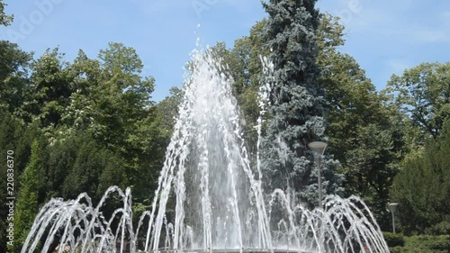 Fountain water jets changing shapes of spraying in public park in Vrnjacka Banja, Serbia.