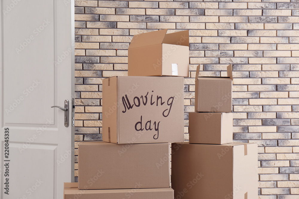Pile of moving boxes in empty room Pile of moving boxes in empty room
