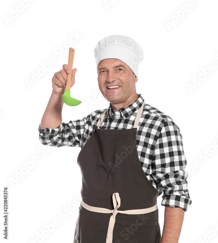 Mature male chef holding ladle on white background