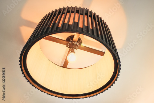Large wooden lamp hanging at the ceiling.