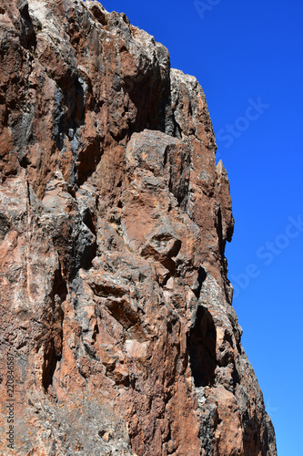 Tibet, one of the geoglyphs on  rock on the shore of the sacred lake Nam-Tso (Nam Tso) against the blue sky, 4718 meters above sea level photo