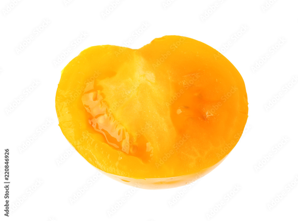 Slice of yellow tomato on white background