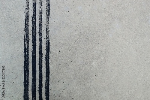 black tire track on dirty concrete after sudden brake
