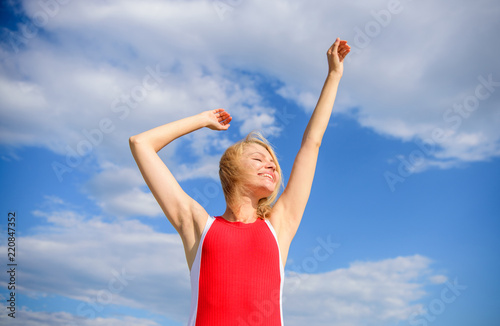 Enjoy life without sweat smell. Woman blonde relaxing outdoors confident perspirant. Take care skin armpit. Girl pleased with warm sunlight looks relaxed blue sky background. Dry armpit summer goal