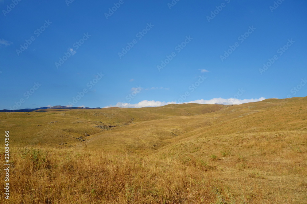 Landscape of a hiking trail leading from Geghard to Sevaberd via Azhdahak volcano in Geghama mountains, Armenia Landscape of a hiking trail leading from Geghard to Sevaberd via Azhdahak volcano in Geghama mountains, Armenia