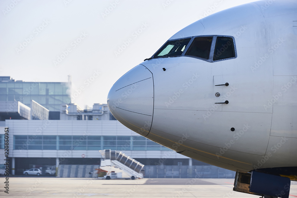 Traffic at the airport. Airplane is taxiing to the runway.