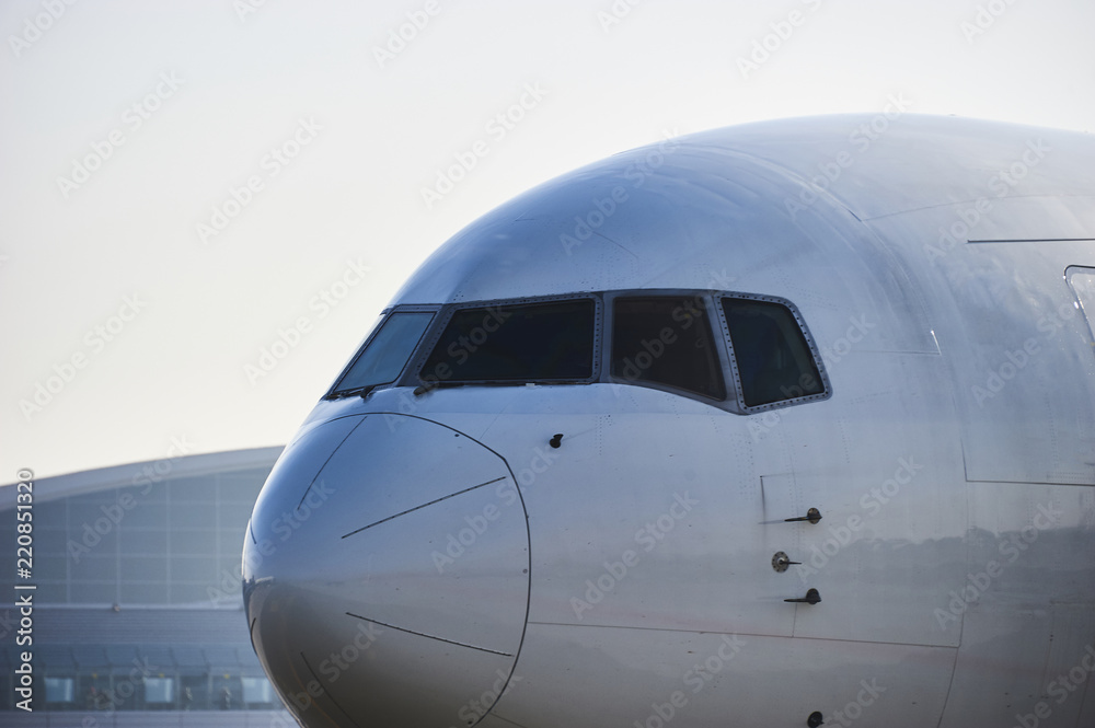 Traffic at the airport. Airplane is taxiing to the runway.