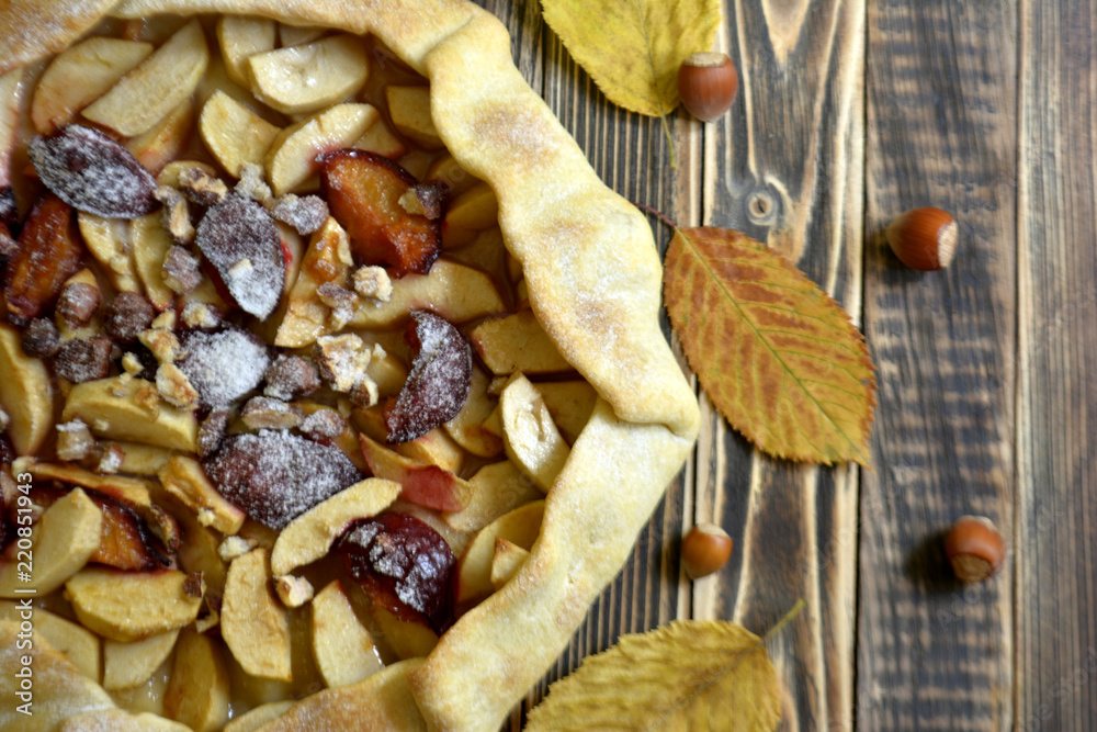 Homemade galette with apples plums and nuts