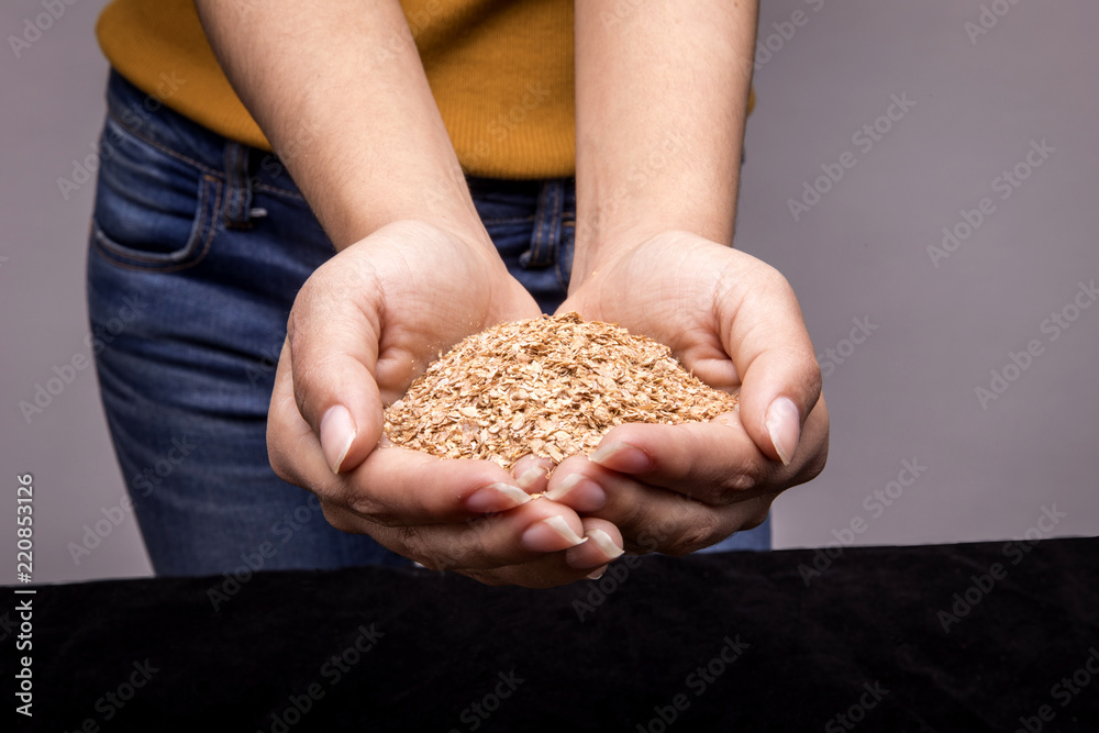 Close up texture of woman hands with different cereals Close up texture of woman hands with different cereals