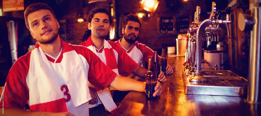 Fototapeta premium Group of male friends watching football match