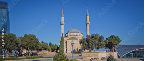 City view of the capital of Azerbaijan - Baku. Famous Flame Towers, mosque and funicular station. photo