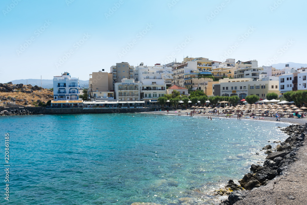 Agios Nikolaos. Crete. The beach on the seafront Akti PapaNikolaou Pagkalou