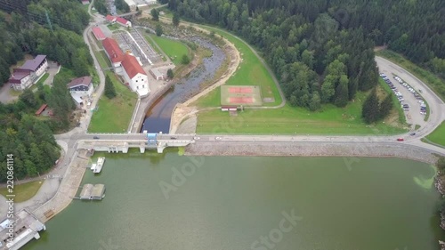 Hydroelectric Dam - Top down aerial footage showing both sides with cars passing. photo