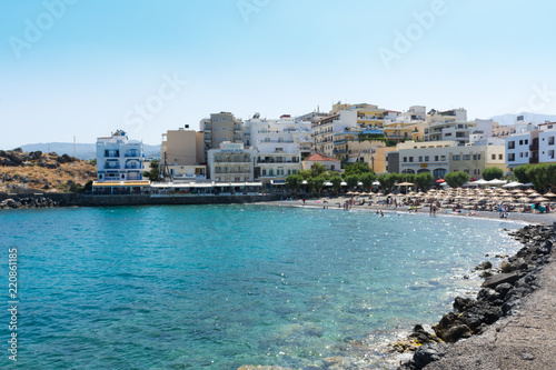 Fototapeta Naklejka Na Ścianę i Meble -  Agios Nikolaos. Crete. The beach on the seafront Akti PapaNikolaou Pagkalou