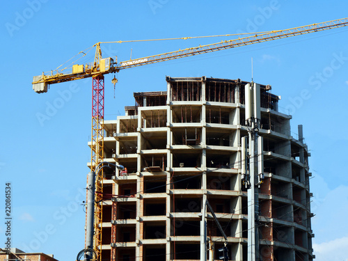 Skyscraper construction. Construction site with crane and building. © fotolian121212