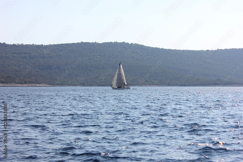 Sailboat In Blue Water