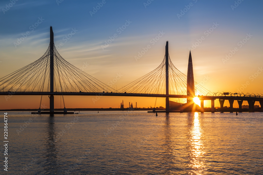 Obraz premium Cable-stayed bridge of Western high-speed diameter through Peter's fairway and the tower of Lakhta center, at sunset, Saint-Petersburg, Russia
