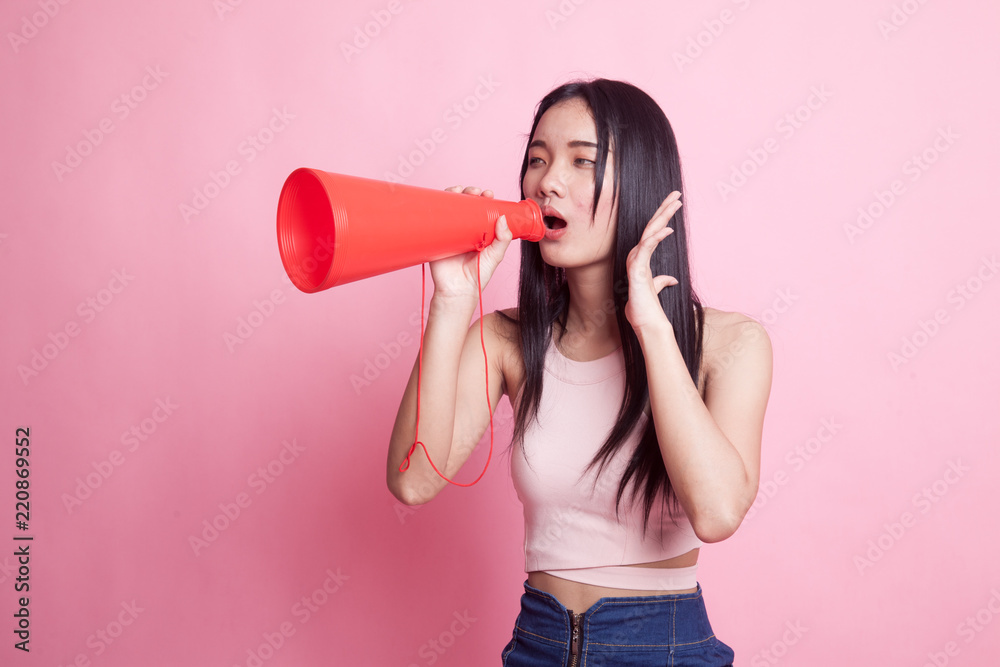 Beautiful young Asian woman announce with megaphone. Beautiful young Asian woman announce with megaphone.