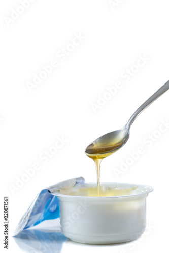 Honey Yogurt. Greek yogurt with honey in a pot with honey product
