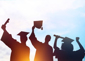 Fir happy college students graduating, silhouettes