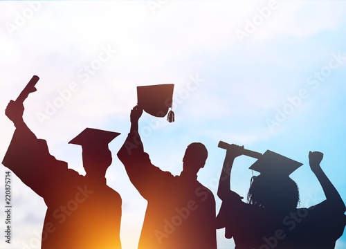 Fir happy college students graduating, silhouettes