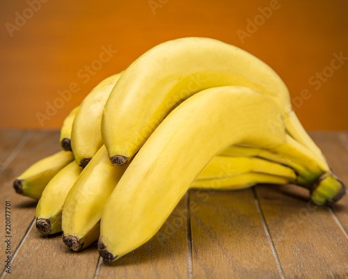 Fresh banana on wooden board photo