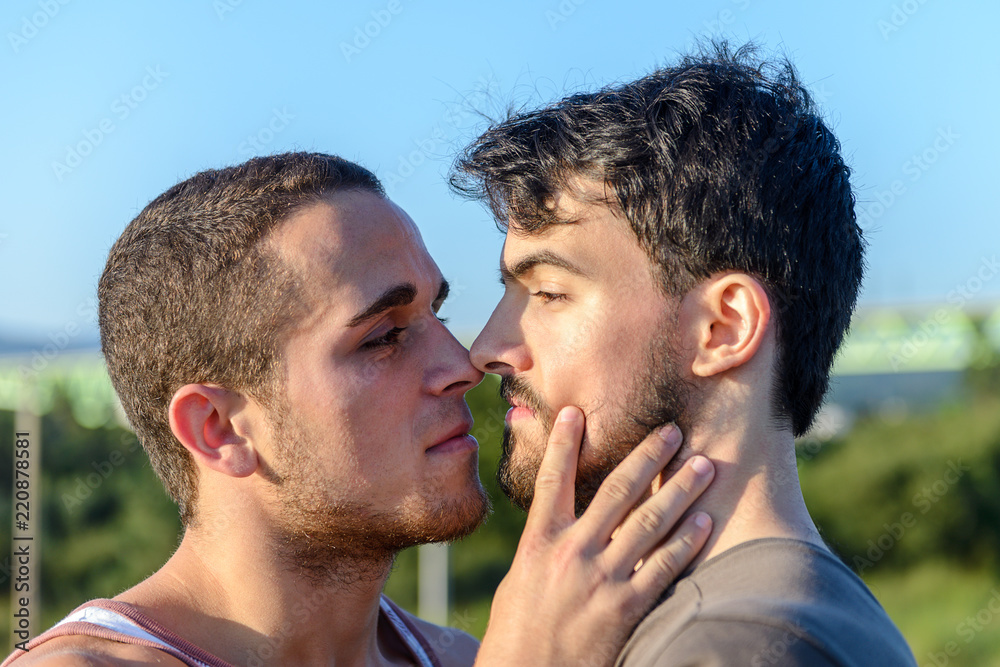gay couple hugging each other gay couple hugging each other