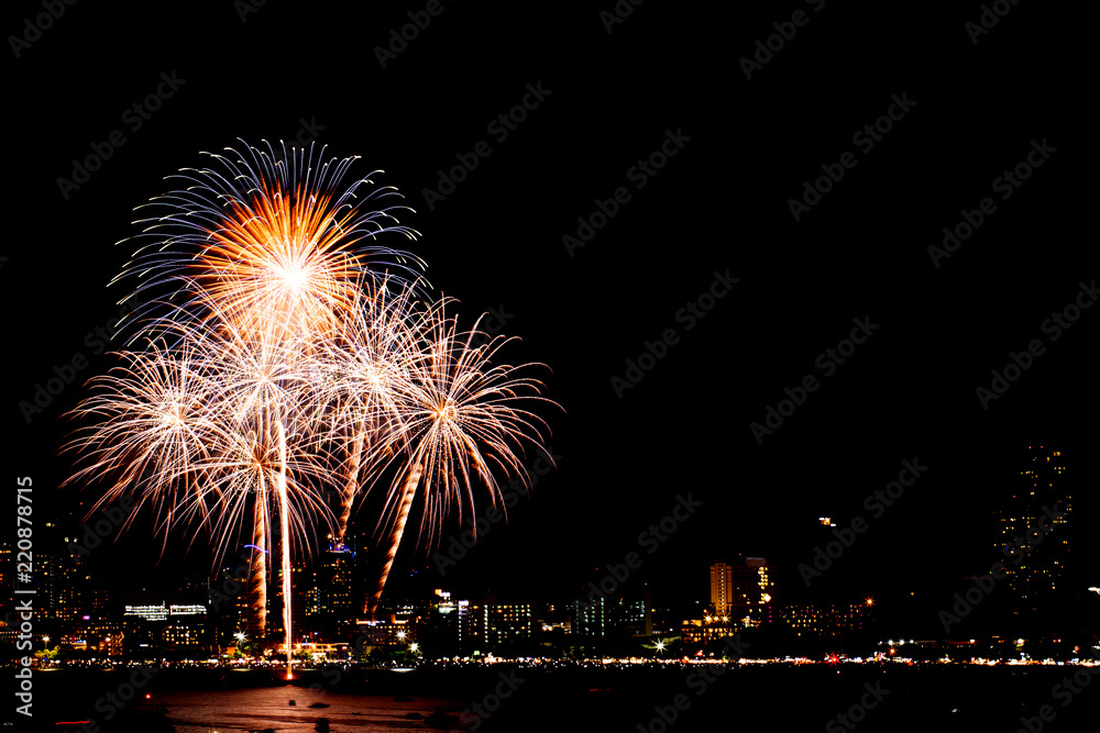 Many flashing fireworks with night cityscape background celebrate New Year. Many flashing fireworks with night cityscape background celebrate New Year.