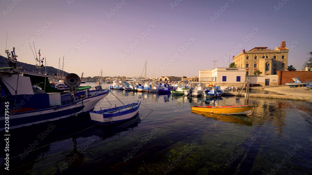 Fototapeta premium Calm water in the quite port of Favignana, Sicily, Italy.