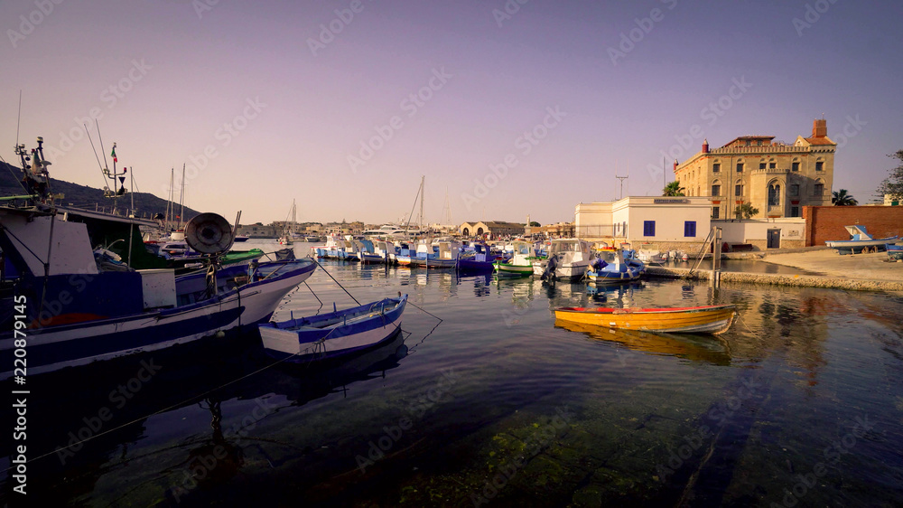 Calm water in the quite port of Favignana, Sicily, Italy.