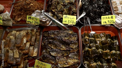 a zoom in shot of marinated fish for sale at nishiki market in kyoto, japan photo