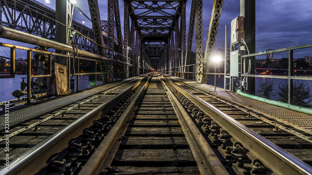 Patullo Bridge, Surrey, British Columbia, Canada. Long exposure of the bridge over the water. Sky Train Bridge. Patullo Bridge, Surrey, British Columbia, Canada. Long exposure of the bridge over the water. Sky Train Bridge.