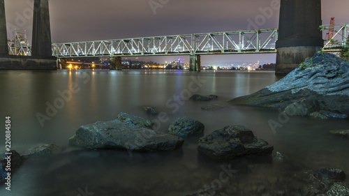 Patullo Bridge, Surrey, British Columbia, Canada. Long exposure of the bridge over the water. Sky Train Bridge. photo