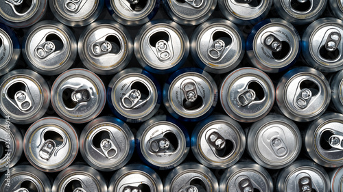Stack of empty aluminum beer cans, front side view, close up, macro with one can being backwards. Be different from your herd.