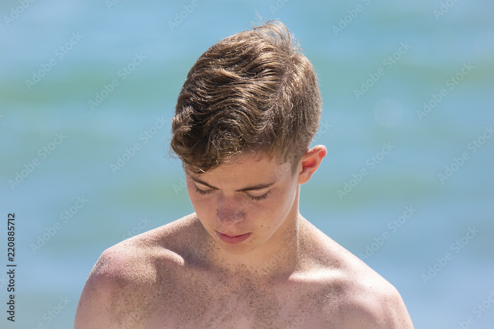 Boy Looking Down at the Beach