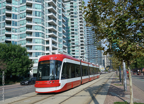 LRT train in waterfront area of downtown Toronto with its own right of way.