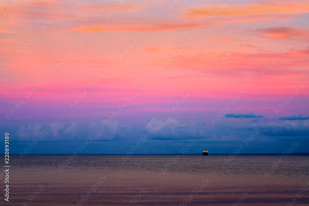 Beautiful sunset at Lake Superior with ship on horizon