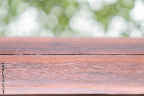 Empty old wood table with backdrop blur bokeh nature garden field background, for display your product and copy space.