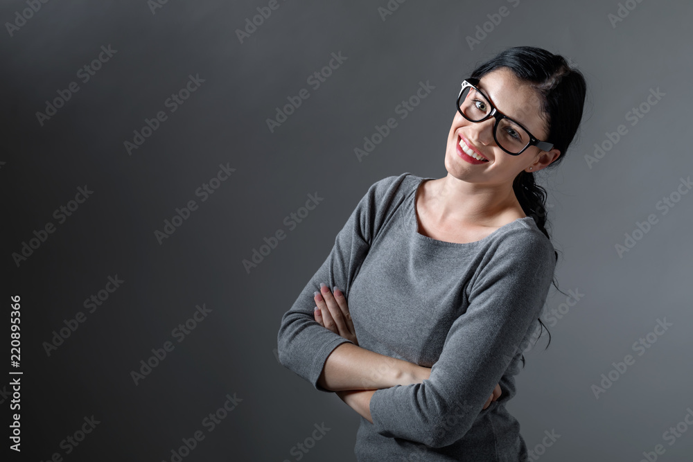 Young woman with crossed arms on a solid background Young woman with crossed arms on a solid background