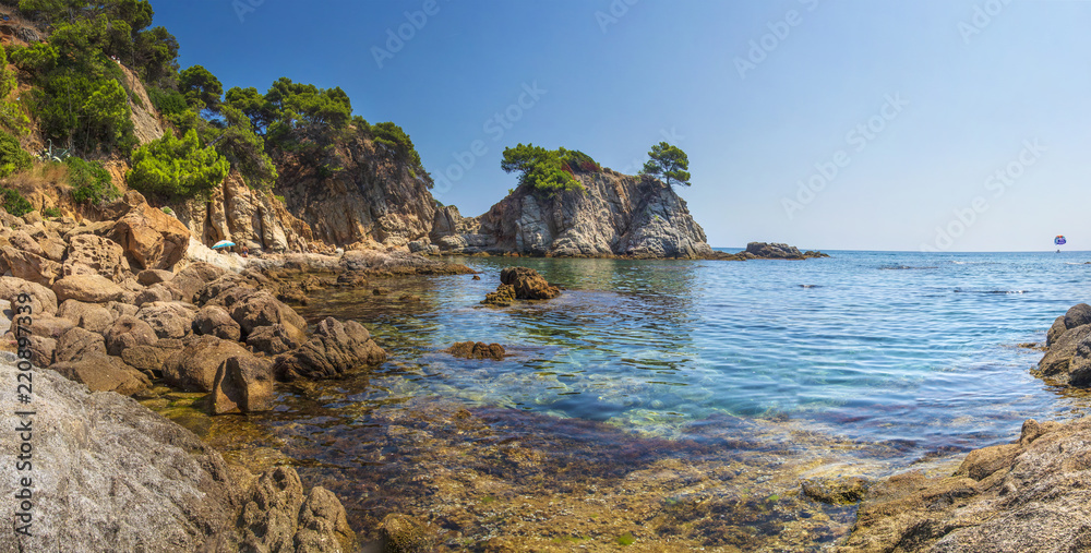 Spain Mediterranean Sea, Bay in Lloret de Mar. beautiful seaside bay in Costa Brava. Amazing seascape of Rocks and stones on sea shore. Beautiful rocky coastline. Landscape of tropical sea nature.