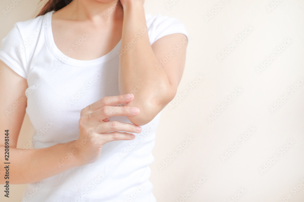 Woman applying elbow cream,lotion , Hygiene skin body care concept.