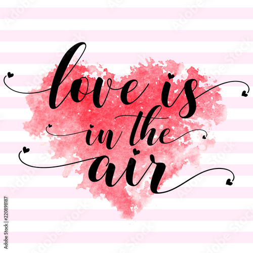 Red watercolor heart and text Love is in the air on a stripped pink white background. For printing on a postcard, T-shirt, cup, etc.