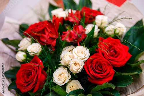 a bouquet of white and Red Roses