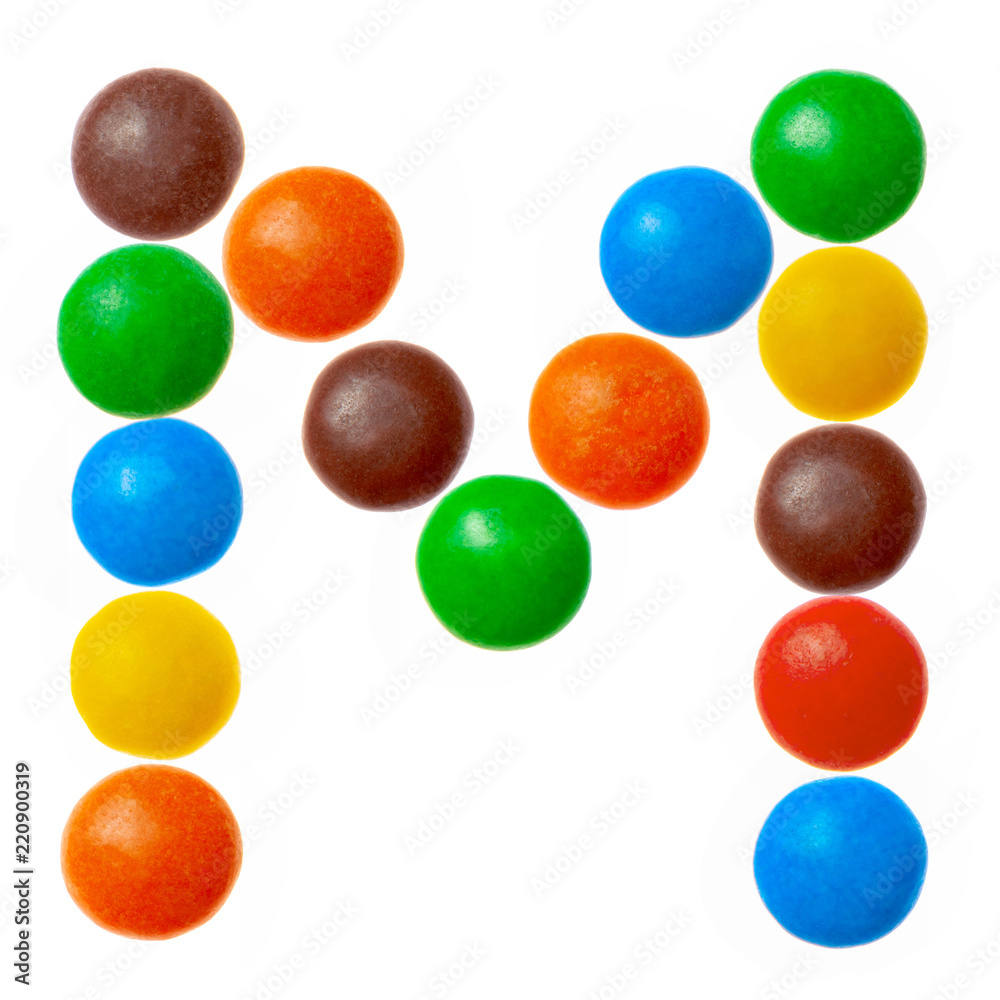 Letter M of sweet colored candies, alphabet isolated on white Letter M of sweet colored candies, alphabet isolated on white