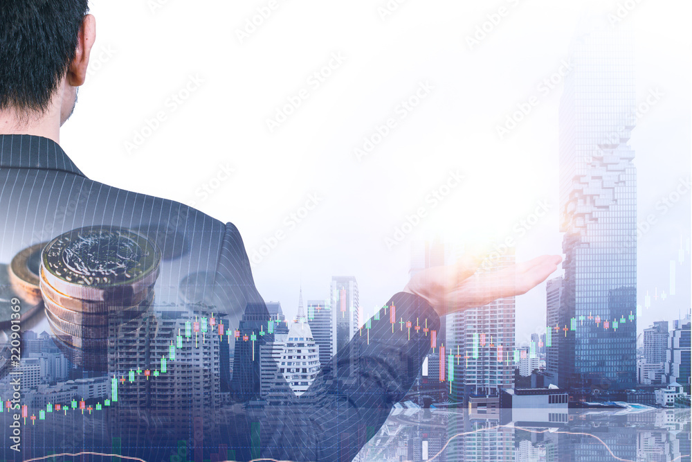 Businessman giving posture overlay with money stock and city background.