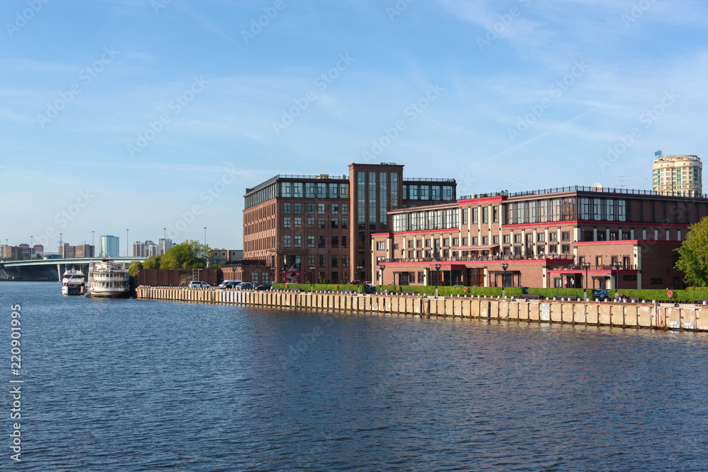 Russia, Moscow August 2018: Building of a modern residential complex on the river bank. View from the boat. Russia, Moscow August 2018: Building of a modern residential complex on the river bank. View from the boat.