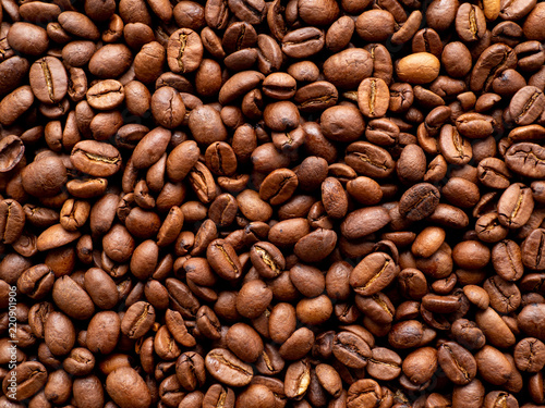 Close-up roasted coffee beans background  top view  copy space